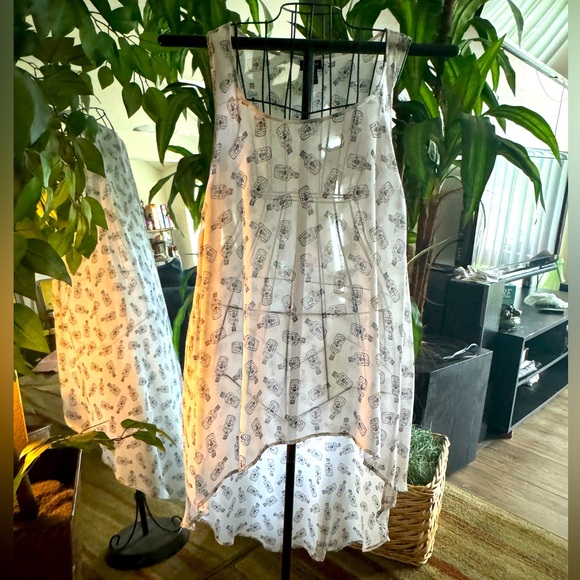 Torrid Hi-Lo Chiffon Skull/Poison Bottle Sleeveless Top - Picture 1 of 7